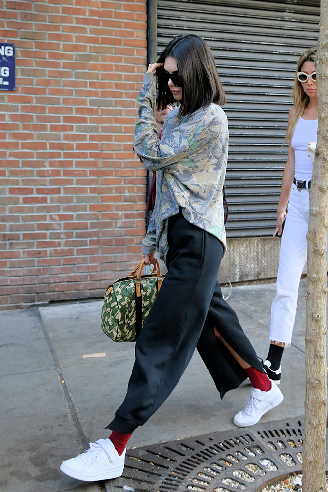 Model Kendall Jenner, wearing red socks, black pants, green top and  carrying a camouflage Louis Vuitton bag leaves Gemma Restaurant in New York  City – THE GOLDEN CRUSH